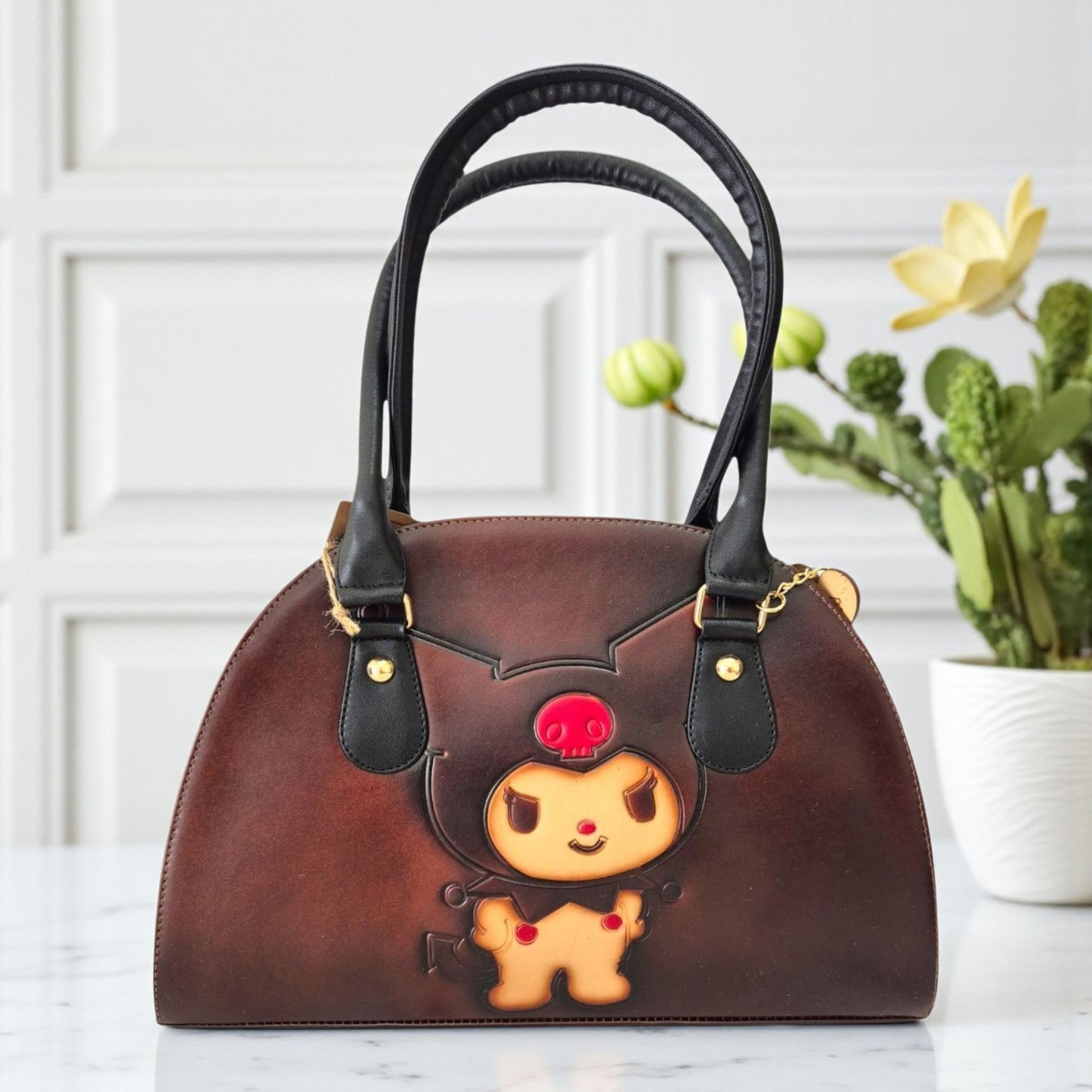 Handmade bag with a cartoon design, two compartments, and an adjustable long strap