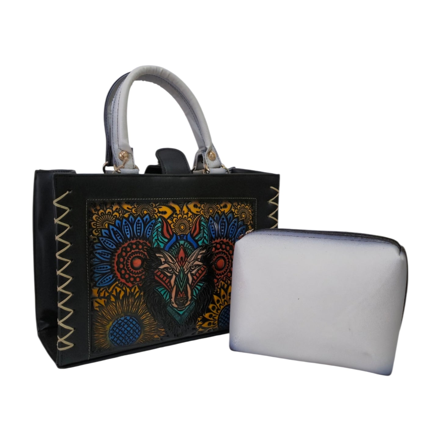 Black handbag with embossed design includes cosmetic bag