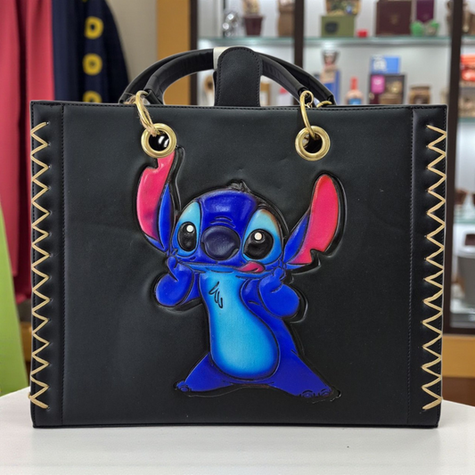 Bolsa artesanal negra con diseño colorido grabado a mano