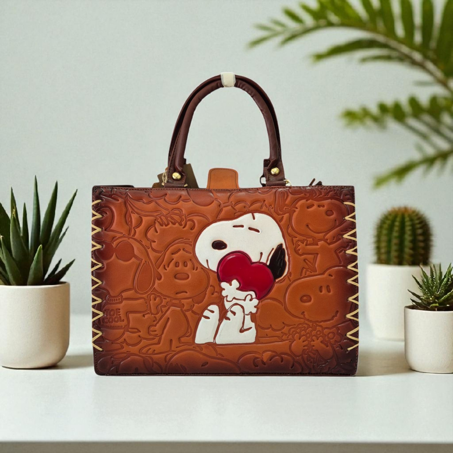 Handmade embossed leather bag with cartoon design and short handle