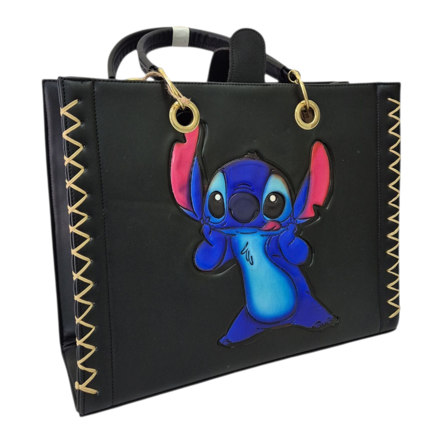 Bolsa artesanal negra con diseño colorido grabado a mano